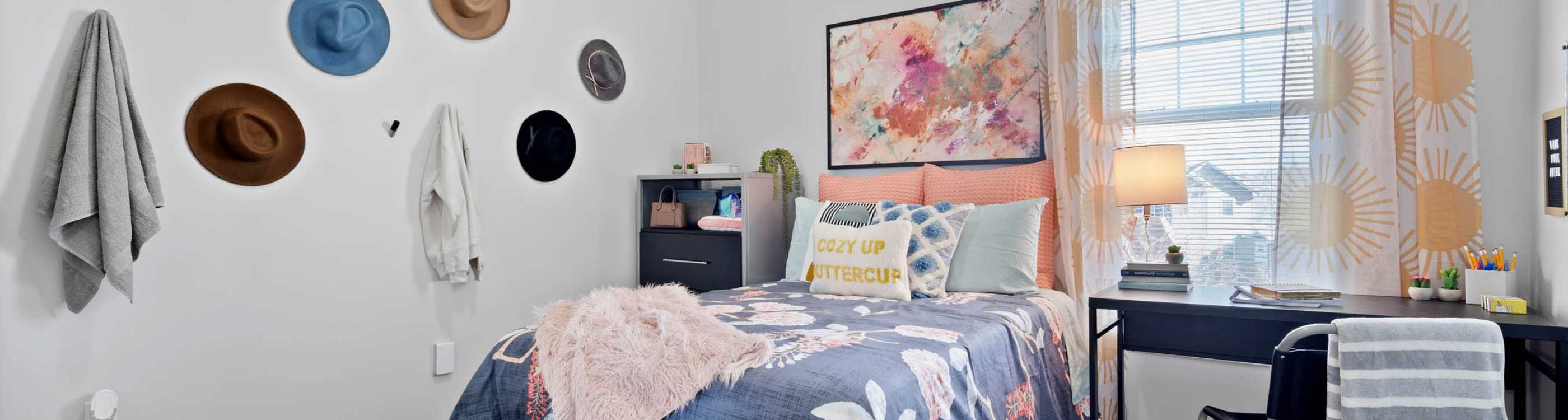 A bedroom with a desk